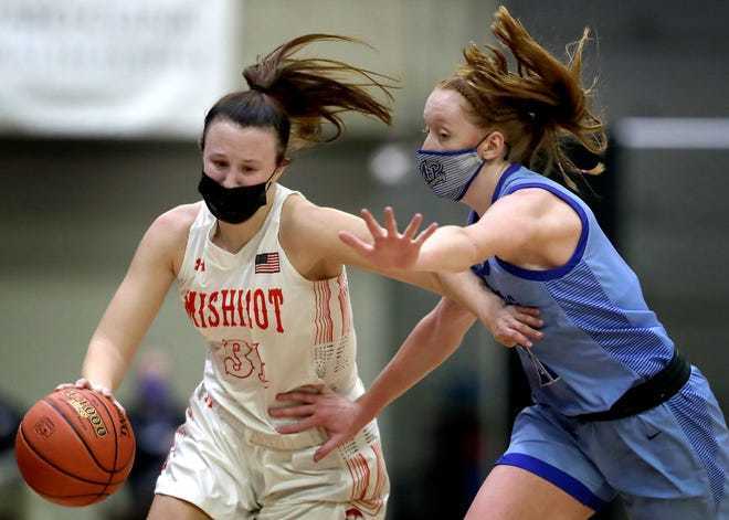 Mishicot High School's Kylie Schmidt (31) against Mineral Point High School's Blair Watters (21) during their Division 4 championship basketball game at the WIAA girls state basketball tournament on Friday, February 26, 2021.